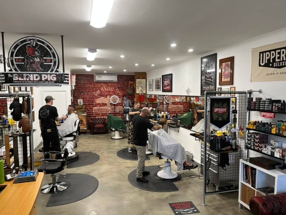 Barbers working inside Cut Throat Joe's
